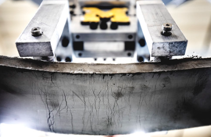 Image of metal-working machine and yellow Michigan M on it