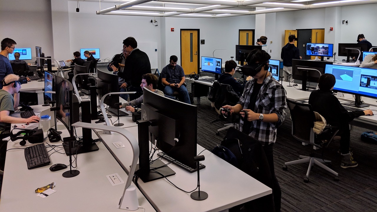 Students working with equipment and on computers in the Visualization Studio