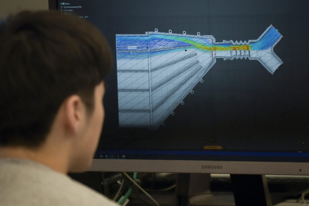 student making model on computer