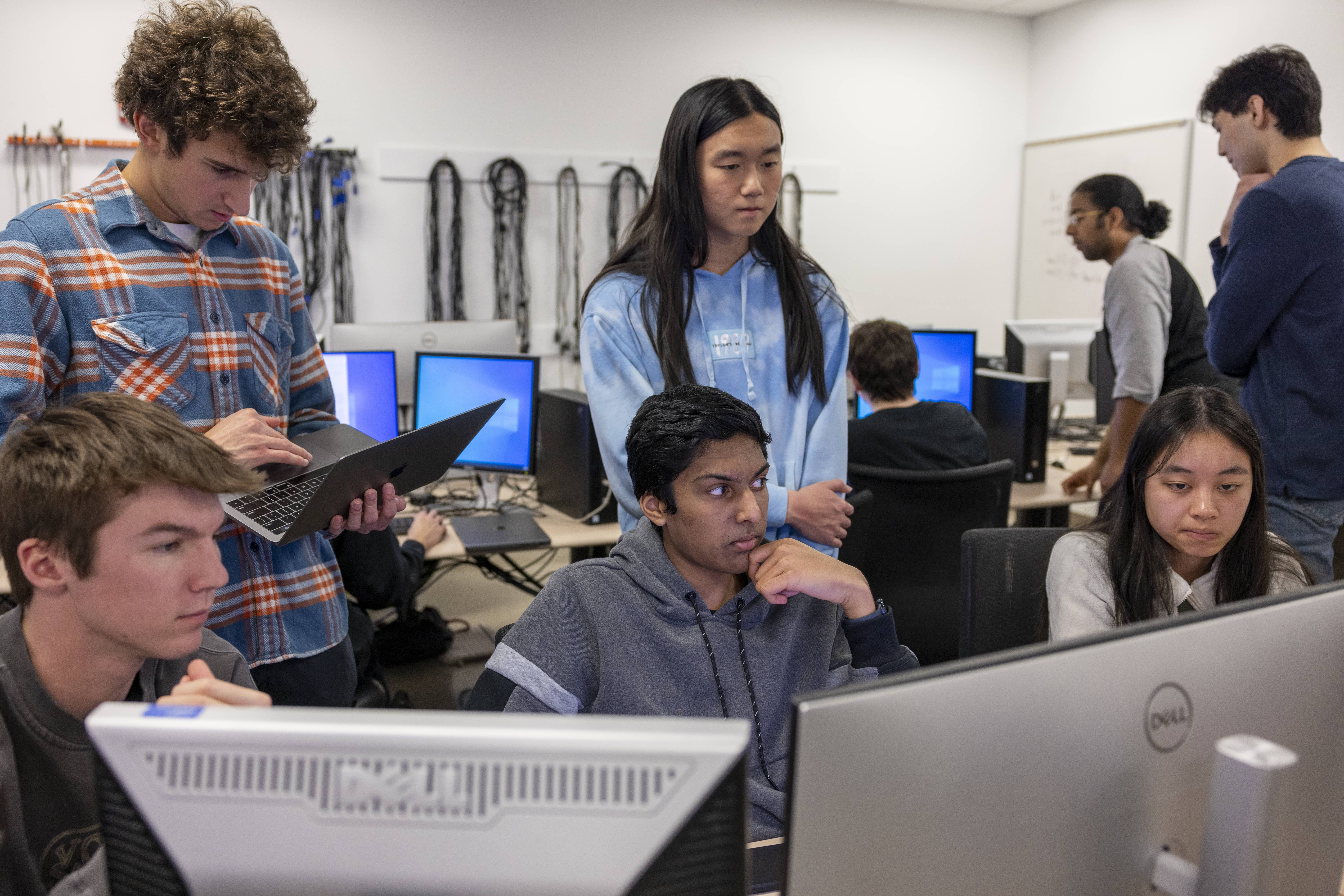 Student drilling two pieces of wood together
