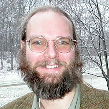 Headshot of Roger De Roo