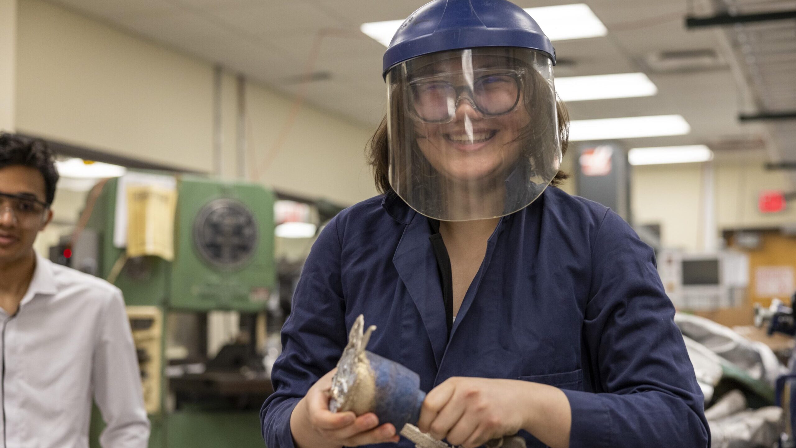 Student drilling two pieces of wood together