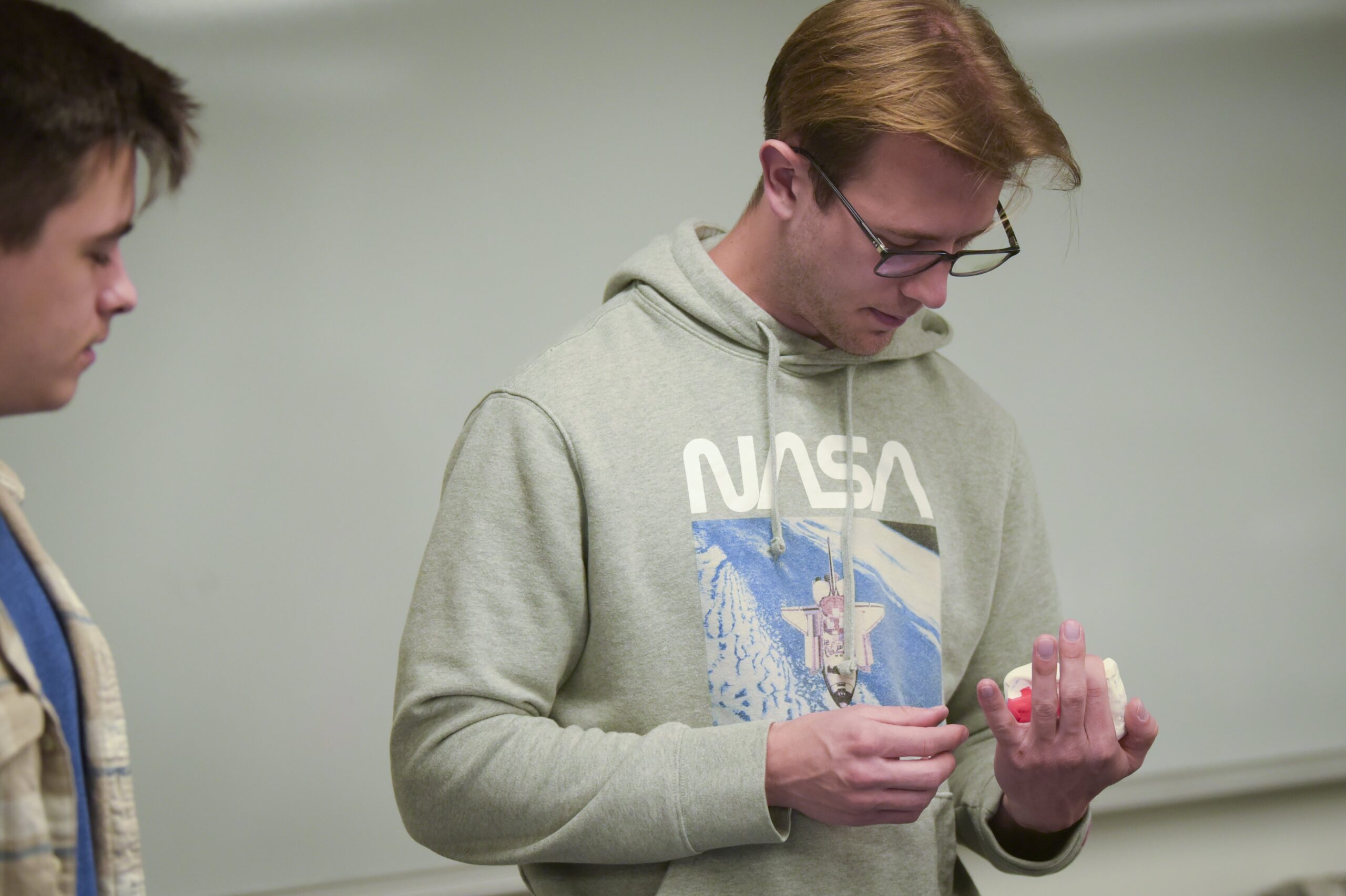 Student drilling two pieces of wood together