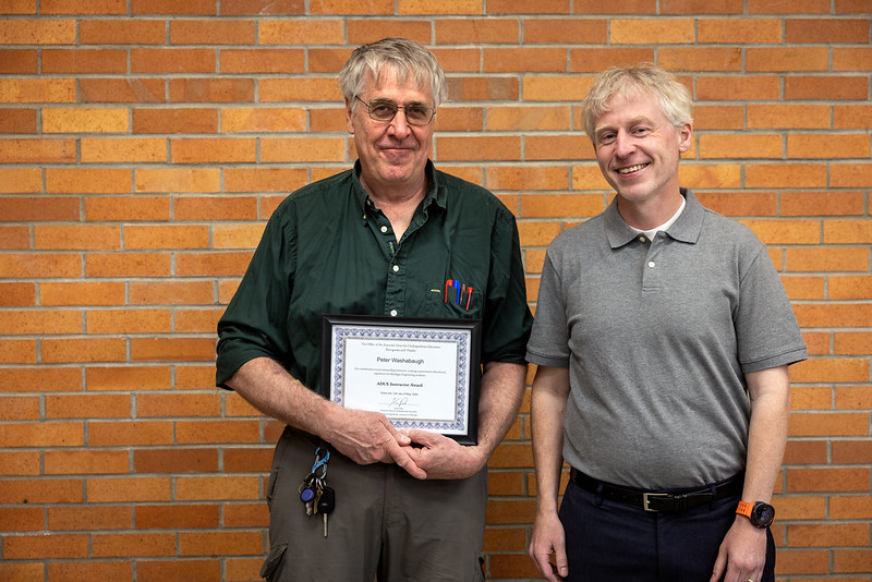 Kevin Pipe presenting "Teaching Award" to Melissa Wrobel