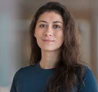 Instructor helping two students with computer program