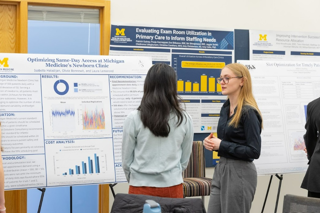 Drawing of a robot holding sign that says “I love ENGR 100” on whiteboard